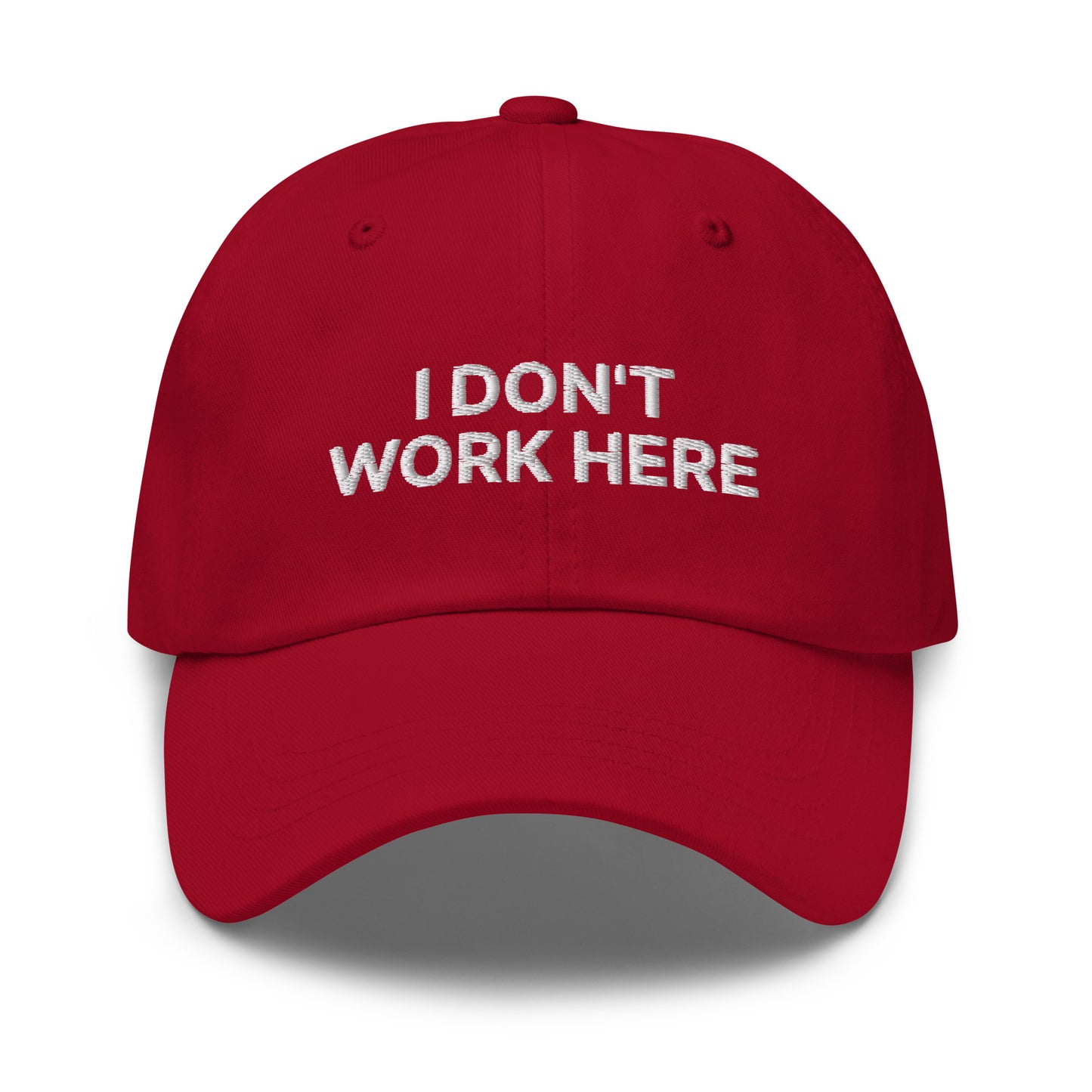 Bild eines Baseball-Caps mit dem Spruch 'I DON'T WORK HERE' auf weißem Hintergrund. Ein humorvolles Accessoire für die Arbeit aus Baumwoll-Chino-Cord.