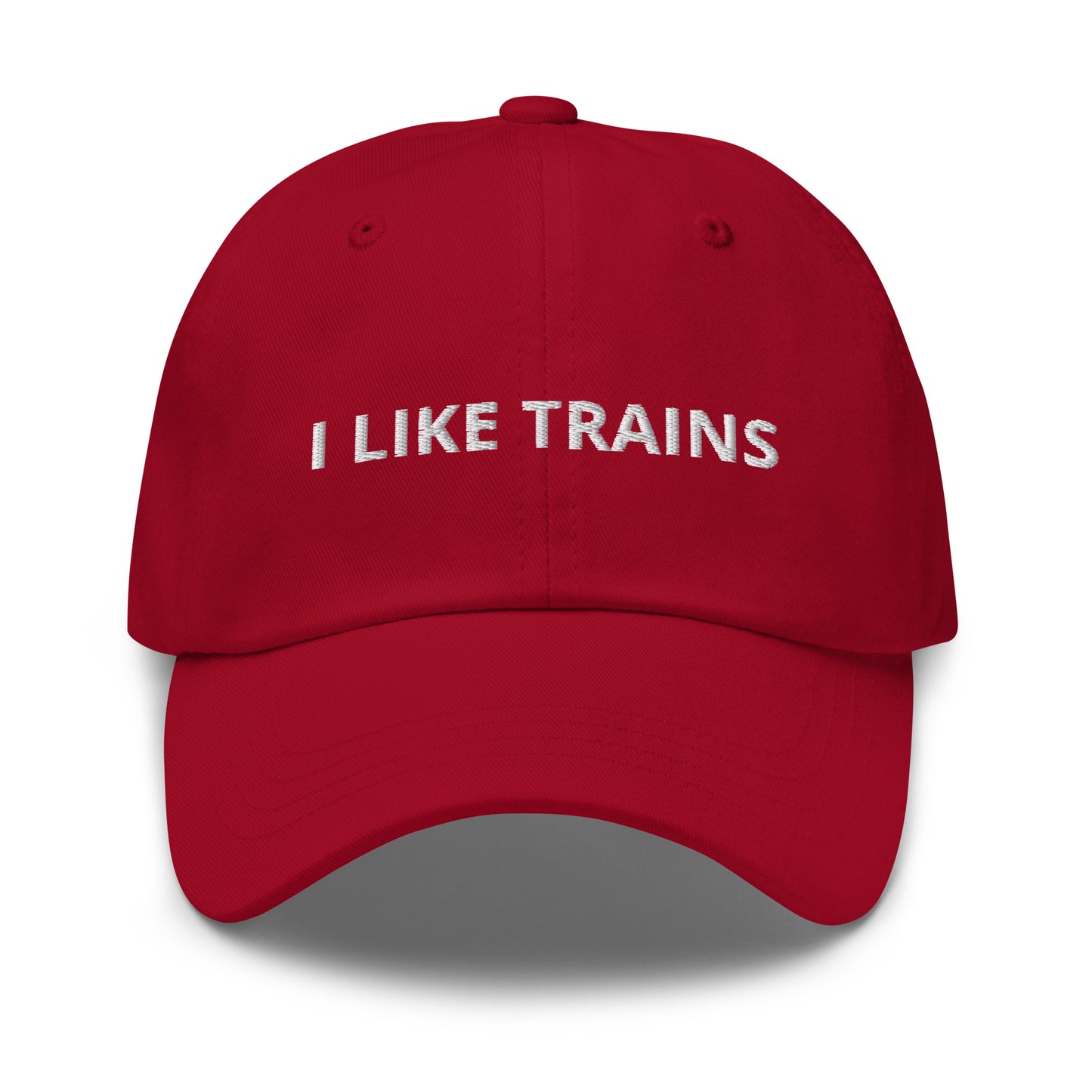Bild eines Baseball-Caps mit dem lustigen Spruch 'I LIKE TRAINS' auf weißem Hintergrund. Lustiges Accessoire für Zugliebhaber mit humorvollem Twist. Hergestellt aus Baumwoll-Chino-Cord.